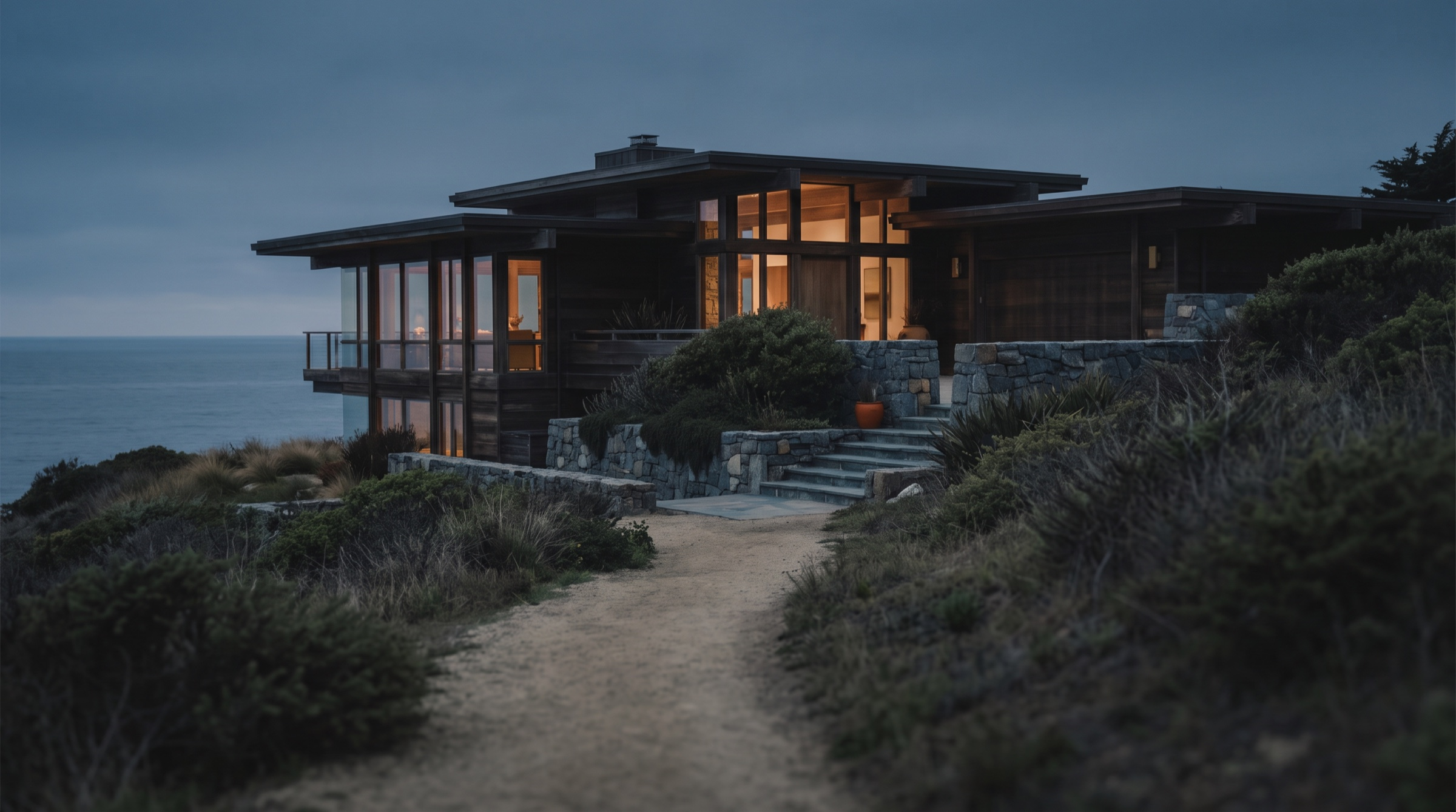 Upscale home exterior at dusk, representing a high-cost VA purchase above the county loan limit.